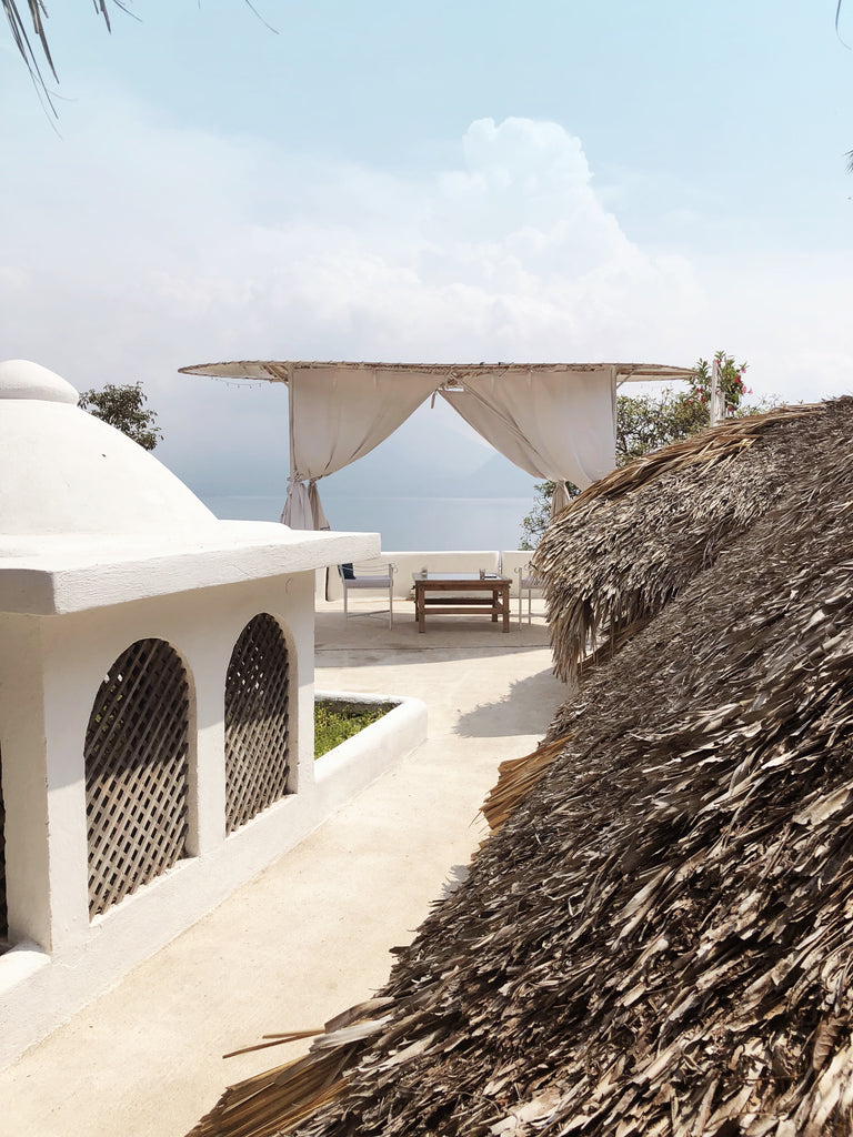 Tzampoc Resort outdoor walkway leads to lookout with benches and chairs by view of lake, resort ideas guatemala, best places to stay on Lake Atitlan, Lake Atitlan hotels and resorts, Santa Catarina hotels