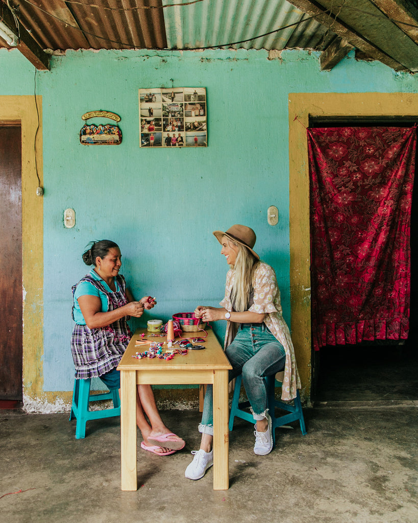 Hiptipico Founder Alyssa sharing with Artisan Women during volunteering day with Ninos de Guatemala