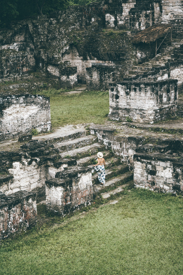 Alyssa walks up steps to head towards pyramid in Tikal, Tikal Guatemala travel, must see places in Central America, Central America travel, Guatemala travel, travel ethically in Latin America, Hiptipico Ethical Travel