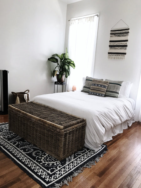 The bedroom is decorated in perfectly minimalistic, boho style