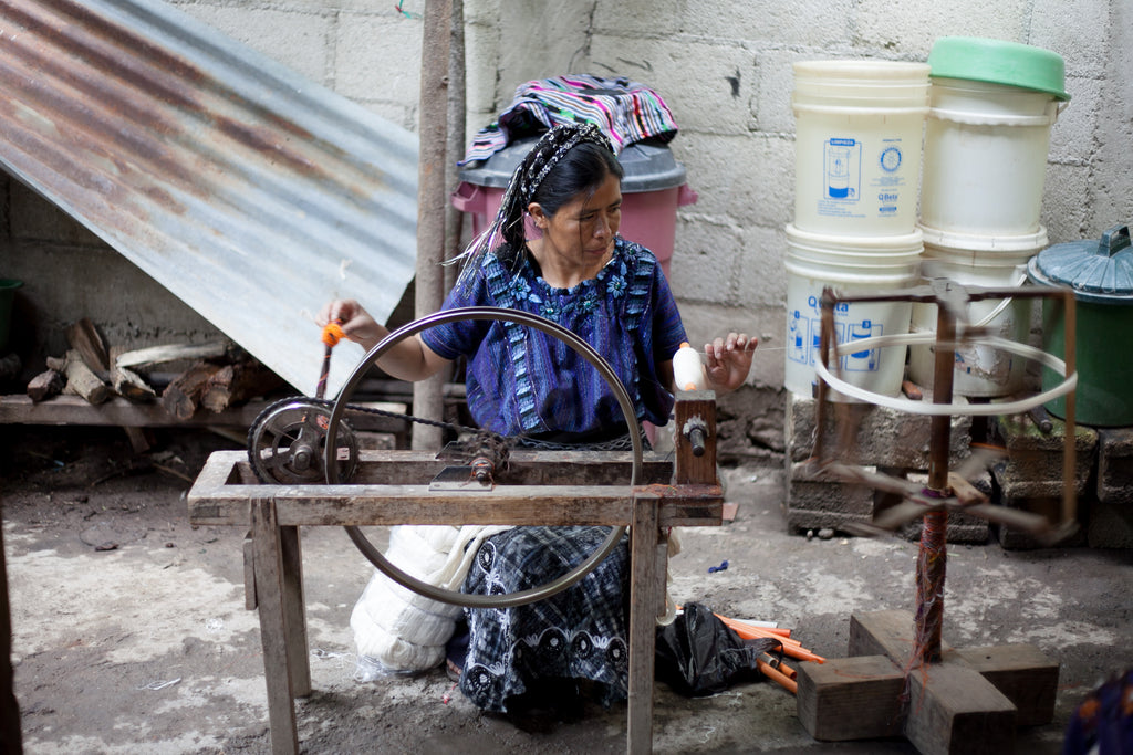 The Hiptipico group of artisans work in Maria's home workshop in San Antonio, Guatemala. They each have a different tool that helps them through the weaving process. 
