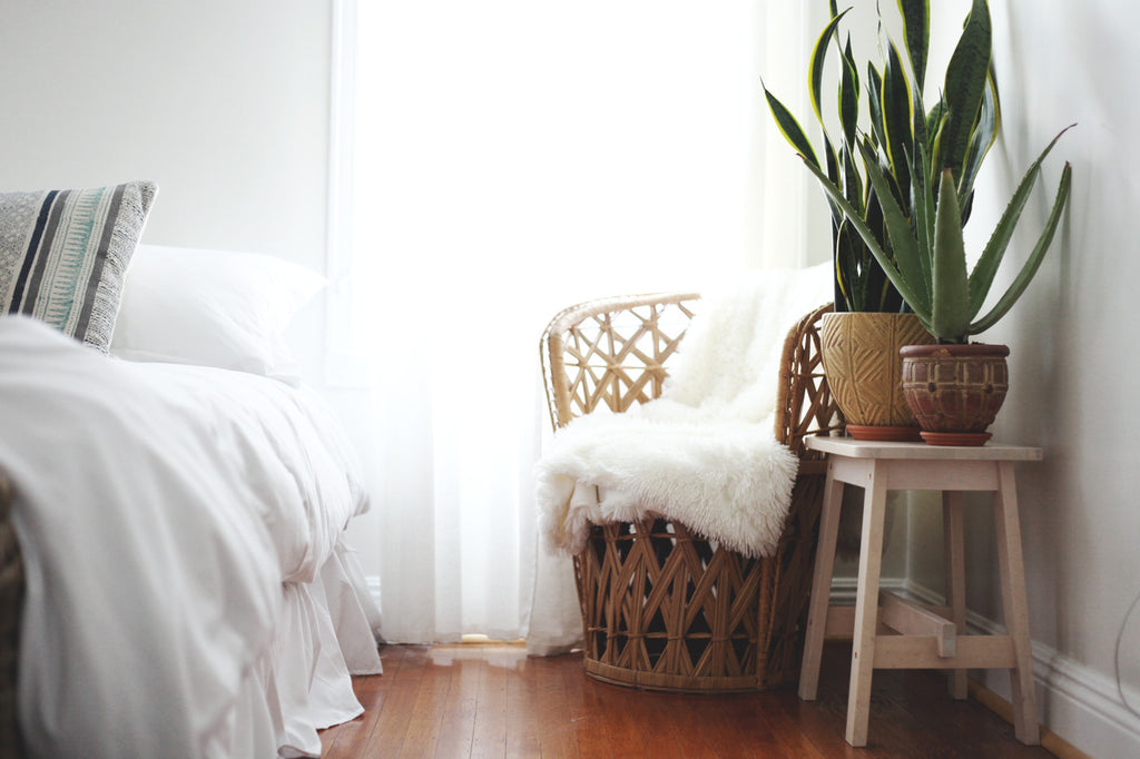 The bedroom is decorated in perfectly minimalistic, boho style