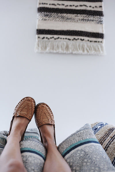 The bedroom is decorated in perfectly minimalistic, boho style