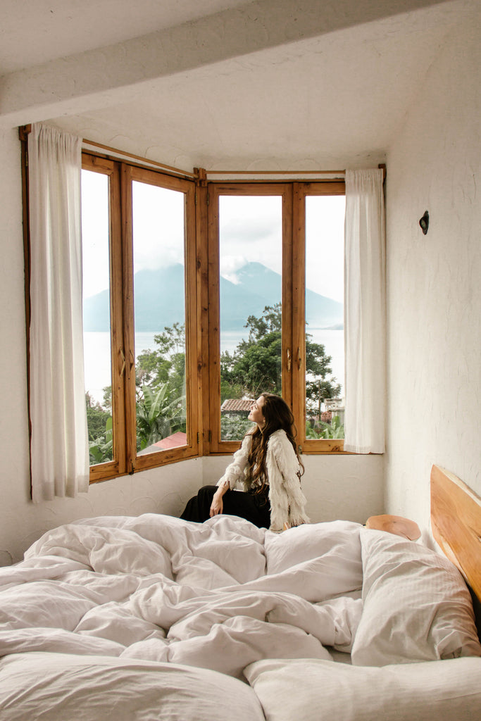 She Is Not Lost blogger Carina Otero admires the view of Lake Atitlan from her bedroom window at Lush Atitlan, where to stay on Lake Atitlan, ecoresorts in Guatemala, boho chic hotels Guatemala, cutest bohemian hotels, hiptipico ethical travel