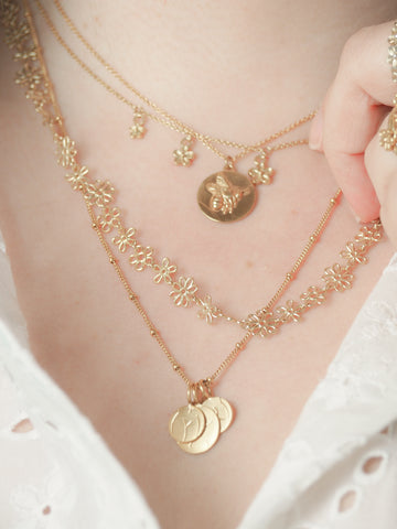 Gold bee coin necklace with flower necklaces