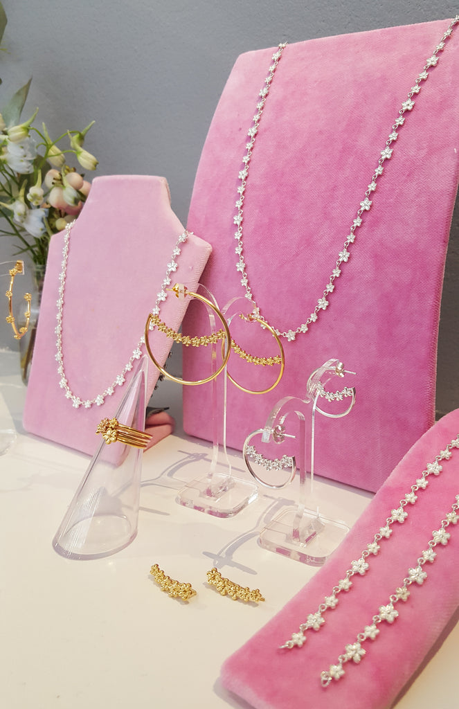 Rachel Whitehead Jewellery IJL  view of garland flower rings necklaces and hoops