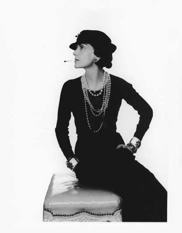 Coco Chanel with pearl necklaces in her black dress