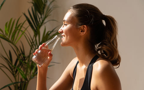 Woman Drinking Water For Healthy Skin