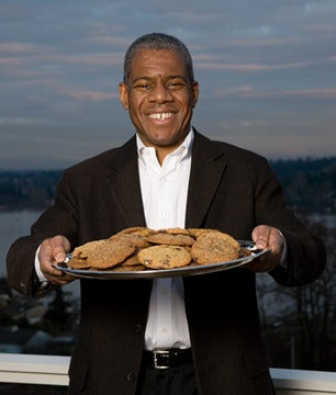 Founder holding tray of cookies