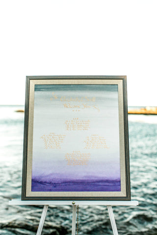 ombre seating chart with gold calligraphy