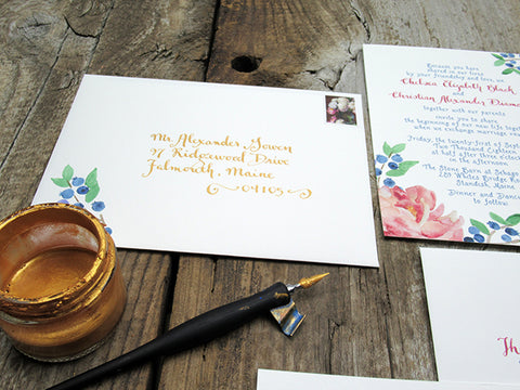 gold calligraphy on wedding envelope