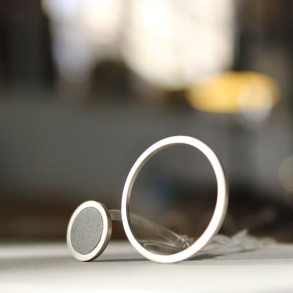 Asymmetrical Circles Concrete Ring, by BAARA Jewelry. An example of a statement minimal ring