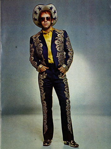 Elton John wearing Nudie Cohn suit and Stars Cowboy Hat 