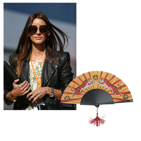 Formula One Girlfriend wears leather jacket and Khu Khu tiger tiger fan added to image 