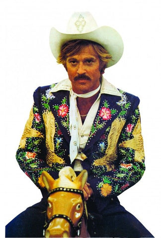 Robert Redford in Electric Cowboy wearing Nudie Cohn suit on fairground horse