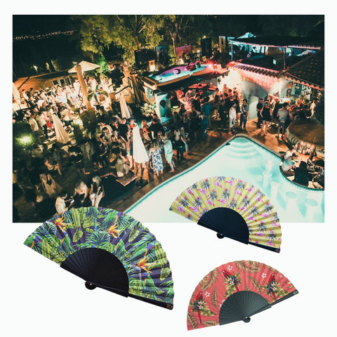 Three Tropicana Khu Khu hand-fans on top of an image of Pike´s Boutique Hotel in Ibiza