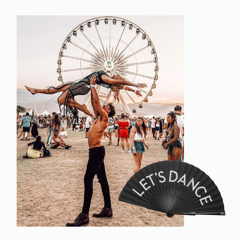 Photo of man and woman dancing at Coachella, woman lifted above man's head and Khu Khu Let's Dance hand-fan