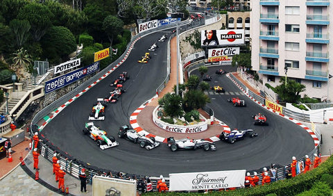 Monaco formula one sharpest bend in the track with lots of cars going round the corner
