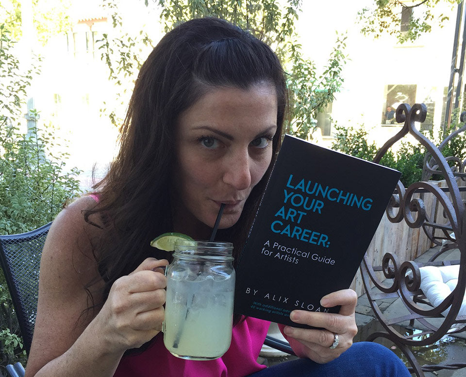 Alix Sloan with her book, Launching Your Art Career: A Practical Guide for Artists