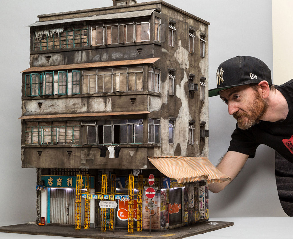 Joshua Smith with one of his miniatures. Photo by Andrew Beveridge.