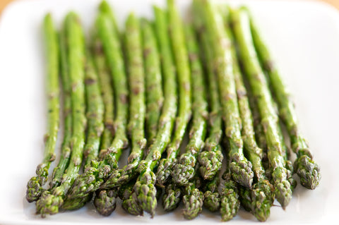 Stalks of asparagus on white background