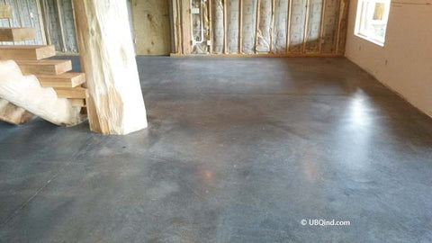Plain concrete before adding concrete acid stain to the basement floor