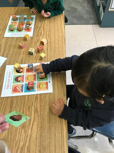 Child playing Feelings BINGO