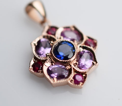 14k gold pendant with sapphires and rubies