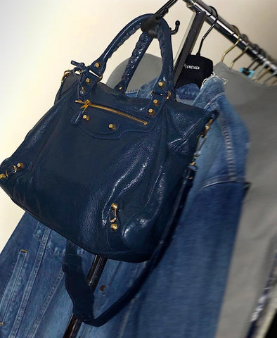 Navy Balenciaga Bag on handbag hanger