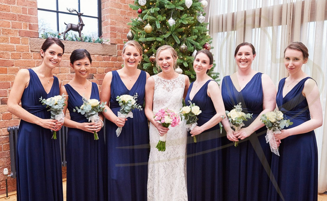 Wedding party with pink Rose bridal bouquet, white Rose and Eucalyptus bridesmaid's bouquets.