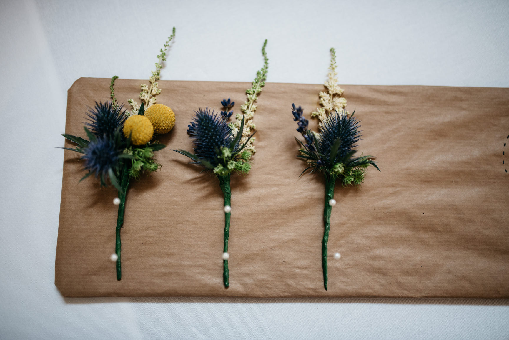 Gents Wedding Buttonholes with Thistle and foliage