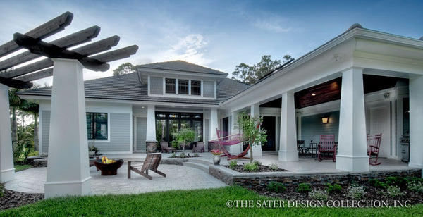 back of the home, large covered porch with expansive veranda with a vaulted ceiling