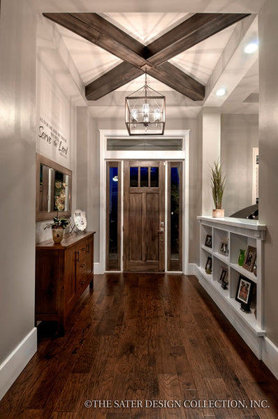 Entry Craftsman-styled divider, beamed ceilings
