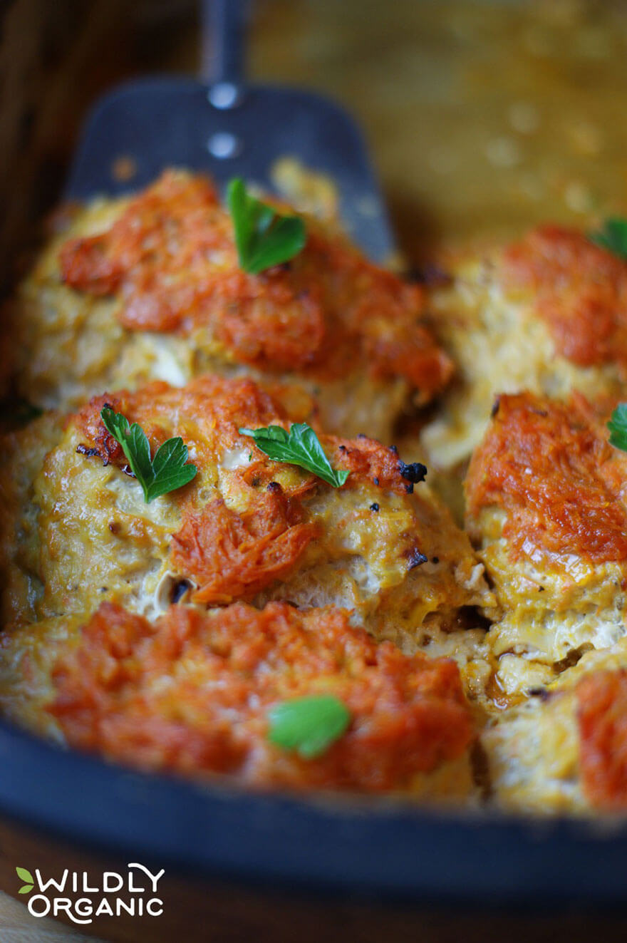 closeup of casserole garnished with green herbs