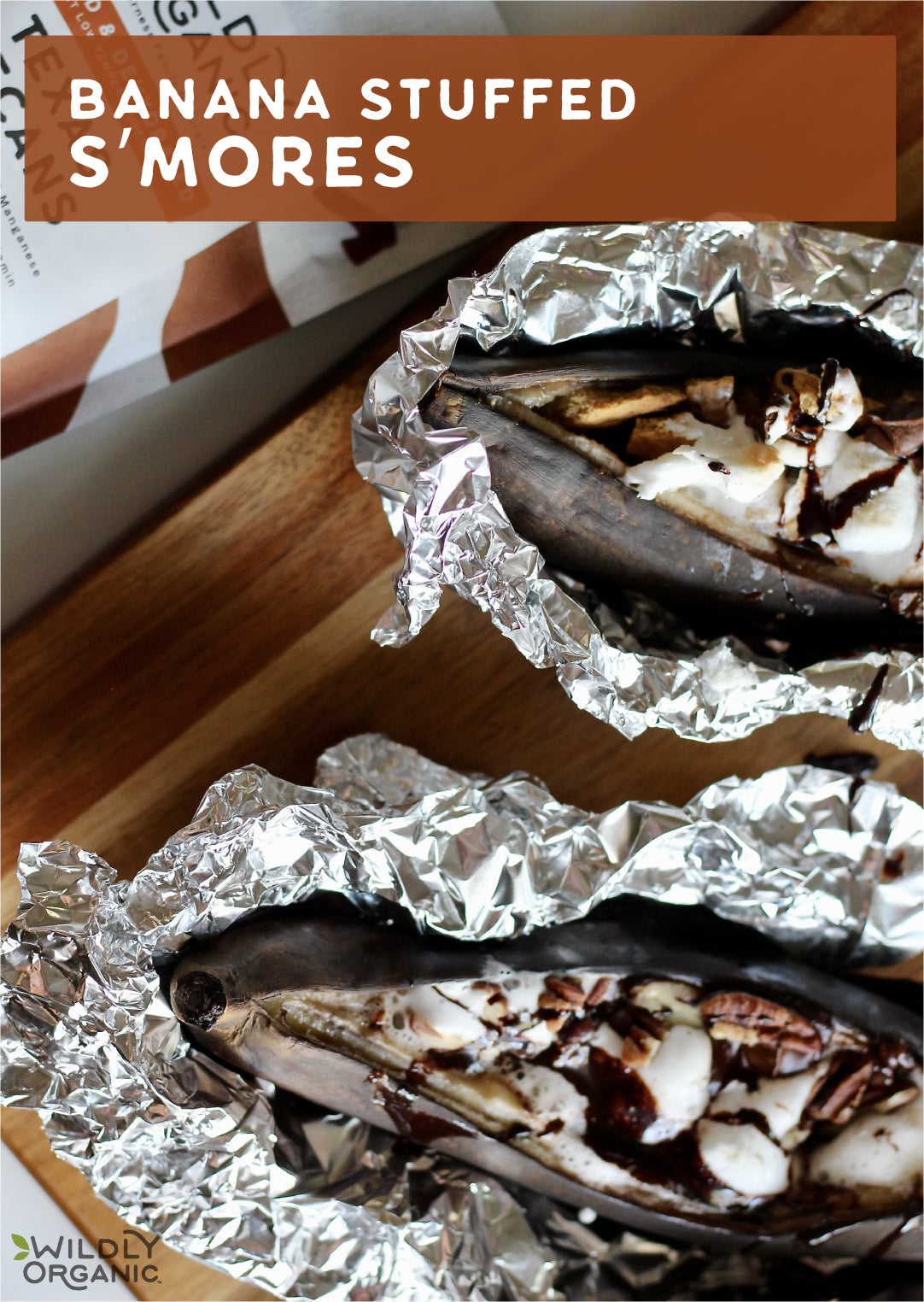 banana stuffed s'mores on a tabletop with Wildly Organic packaging in the background