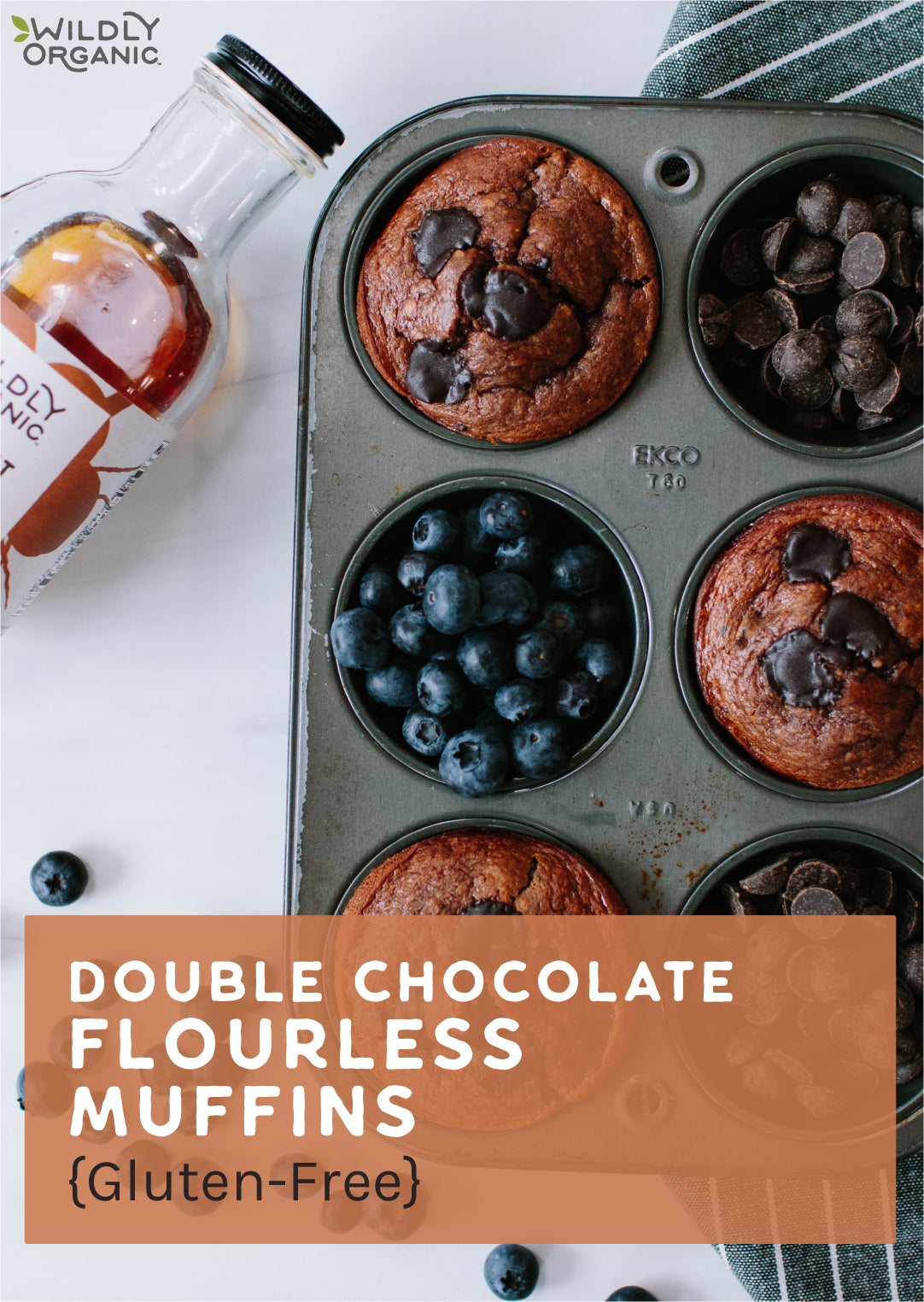 double chocolate flourless muffins in a muffin pan with a bottle of Wildly Organic coconut syrup next to them