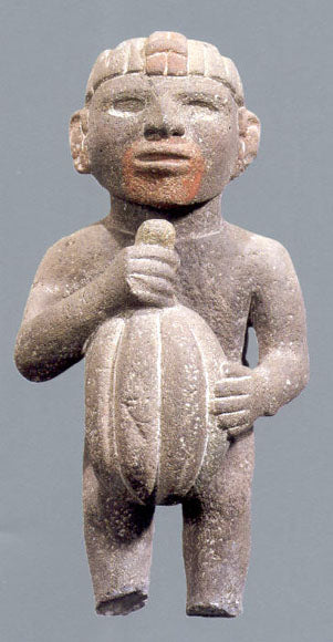 statue of man holding cacao pod