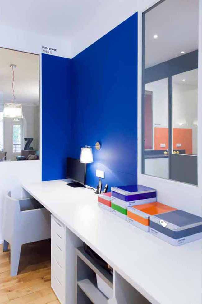 Home office with royal blue wall color