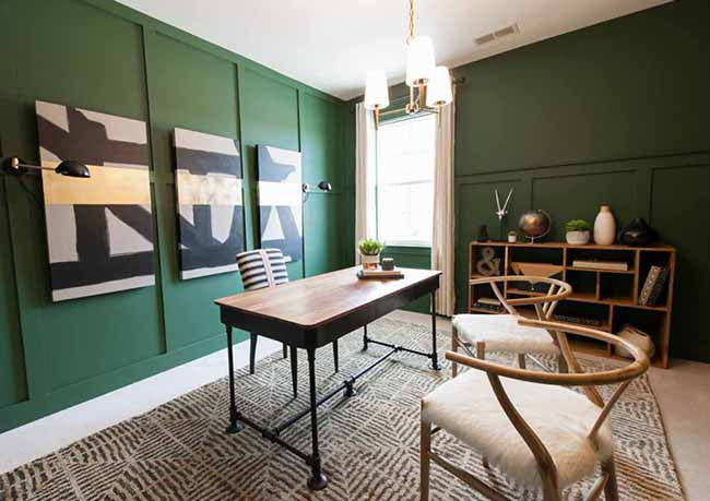 Home office with dark green walls