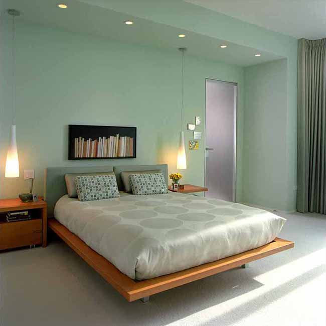 Bedroom with light green-blue colored walls