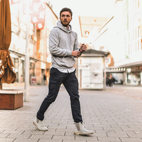 Streetwear outfit with grey hoodie and navy cargo pants