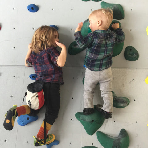 Kids climbing rock wall