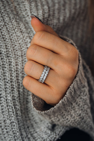 Women wearing two half eternity titanium rings on her ring finger
