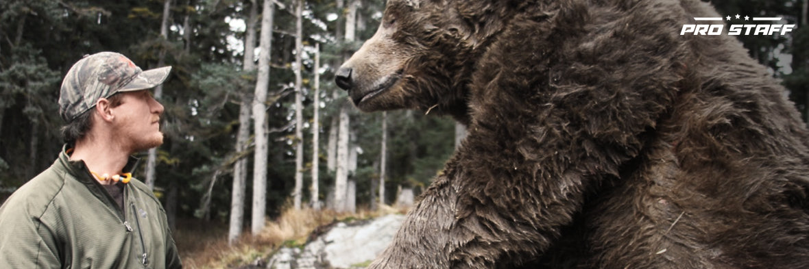 Luke Randall staring at a giant bear