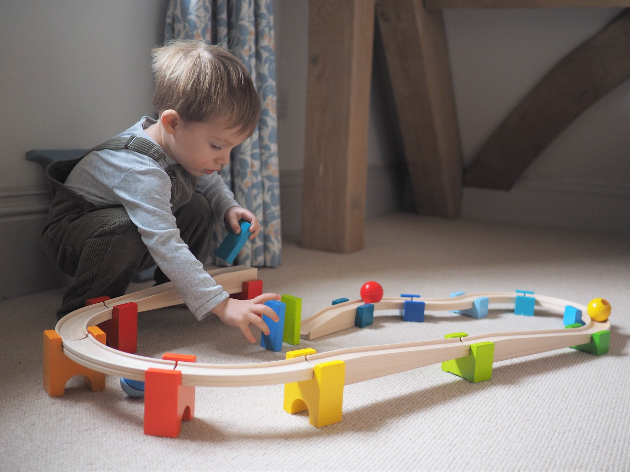 2 year old lining up toys