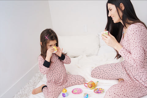 Lav and Kush Rompers mom and daughter drinking tea wearing loungewear on the bed