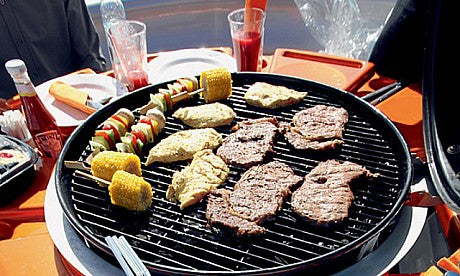 Steaks cooking on Joe's BBQ Boat rental