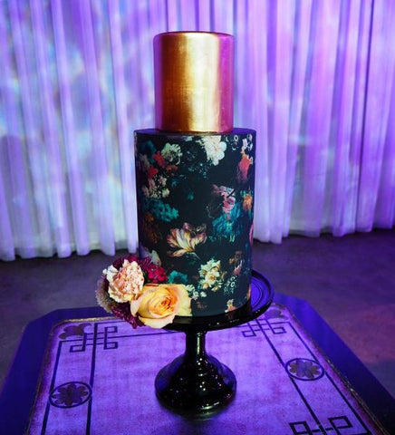 Black floral wrap Alice Broadway cake design