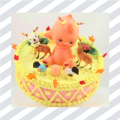 Cake with plastic doll and decorations