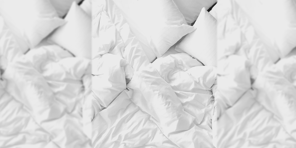 white-bed-sheets-on-bed